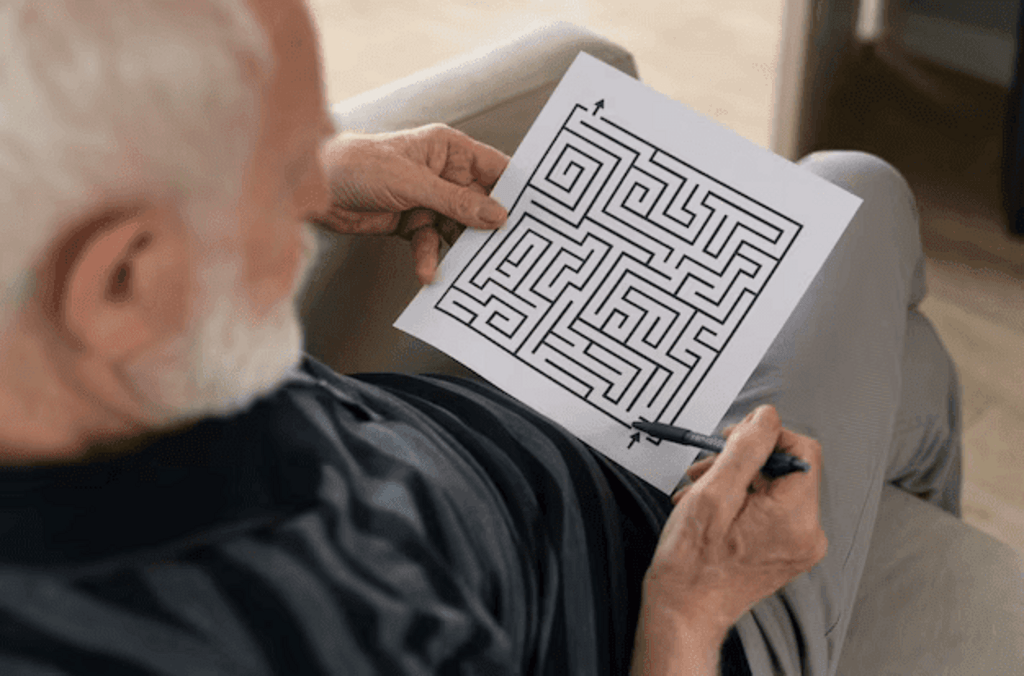 old man solving puzzle